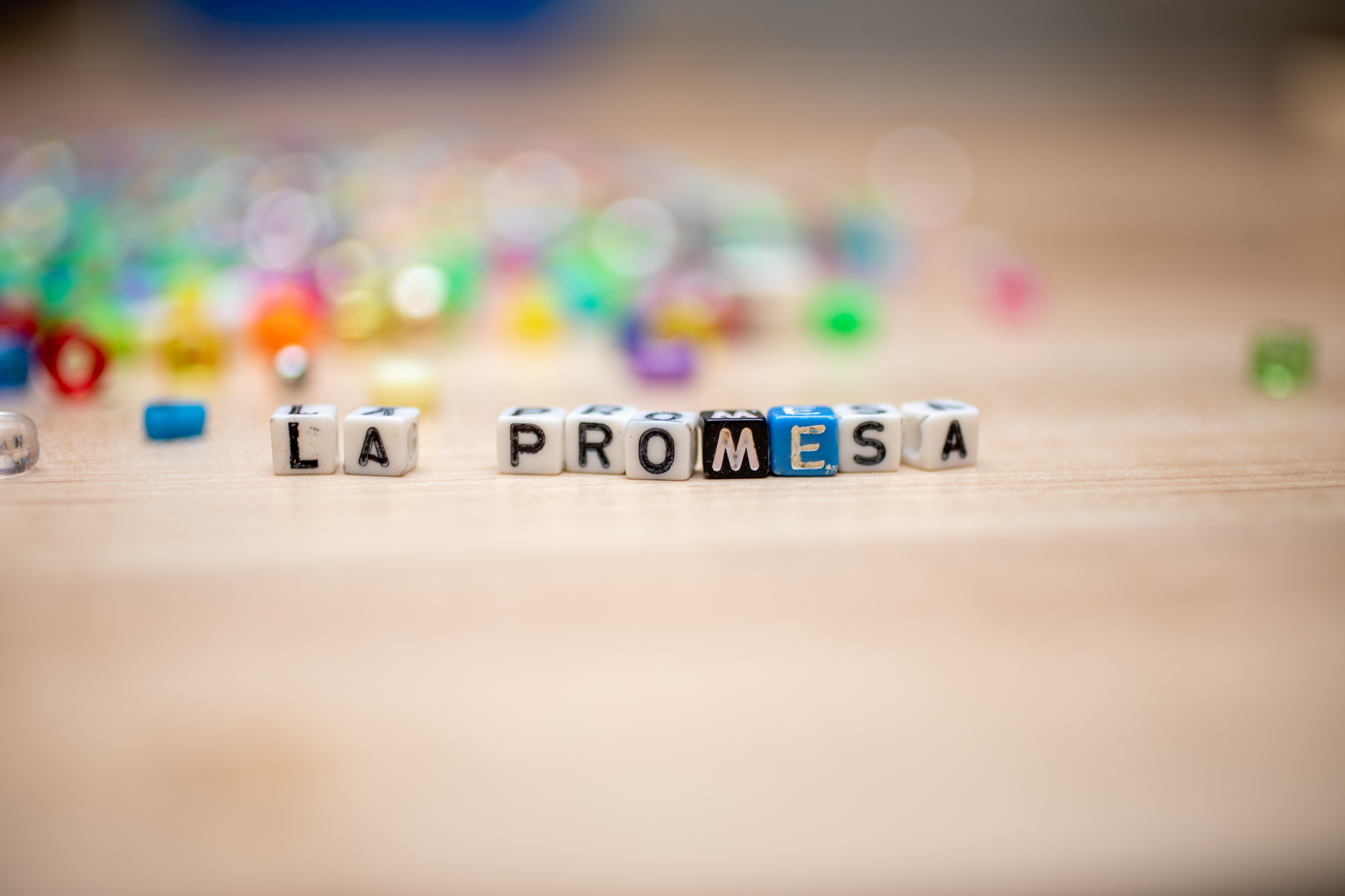 Beads that spell out La Promesa