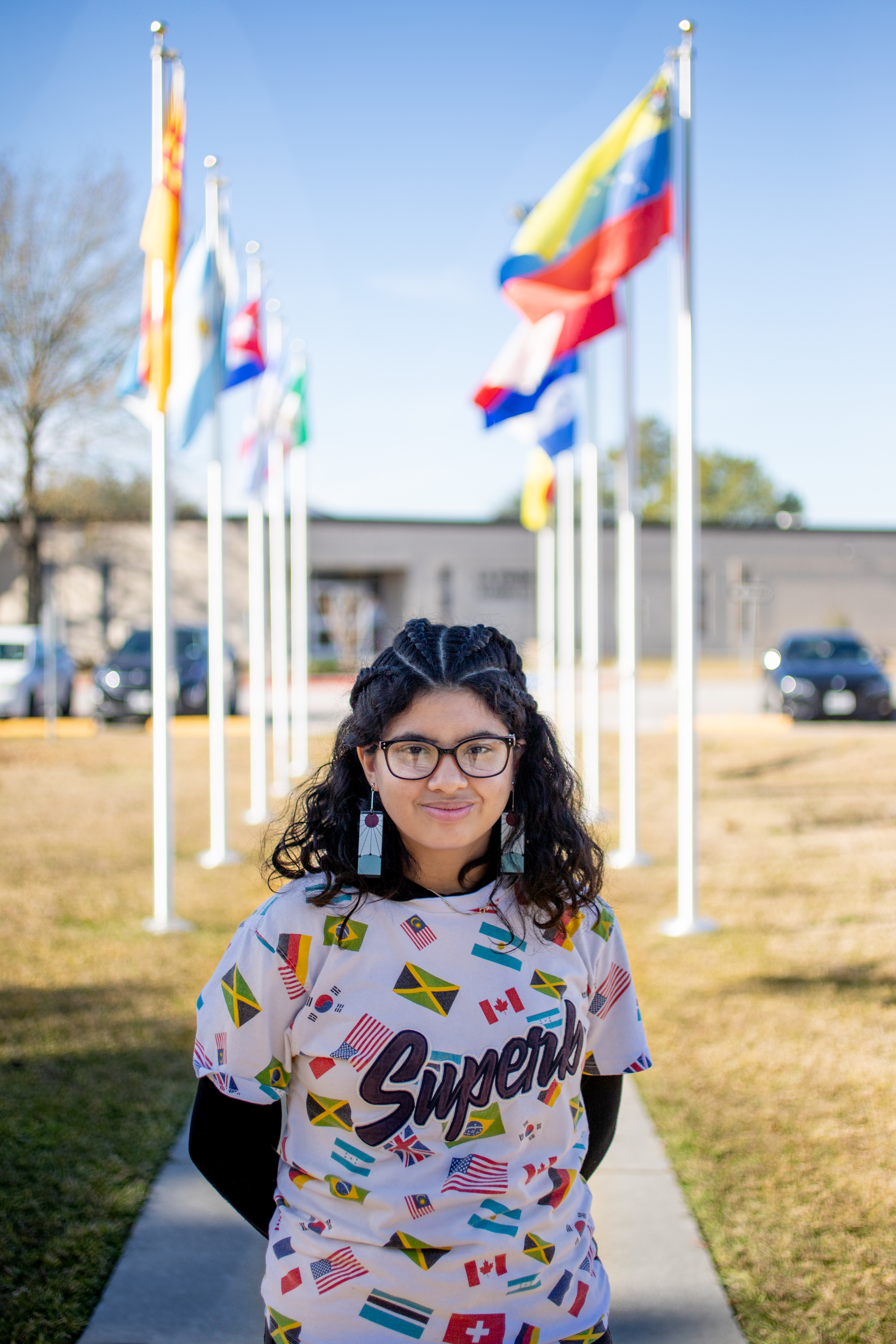Girl standing in front of school